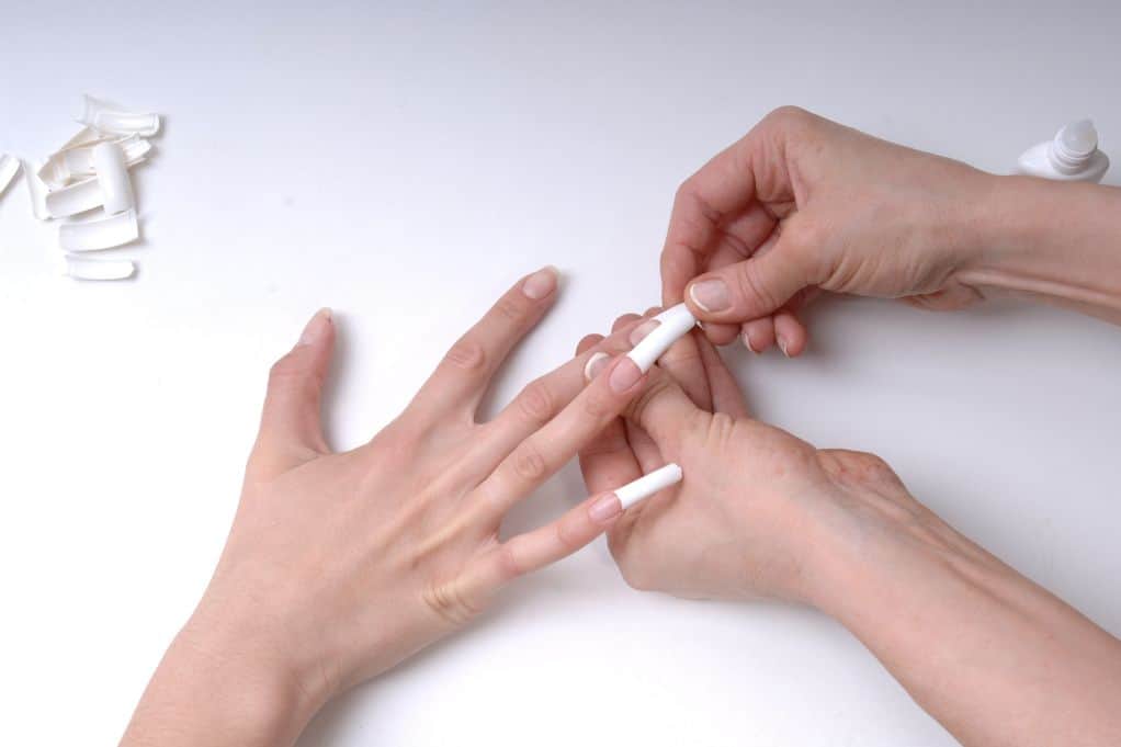 Acrylic nails being put on