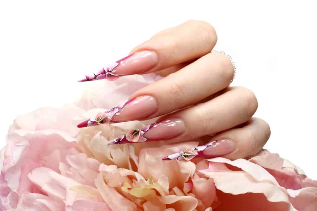 Elaborate acrylic nails which increase the price of nails