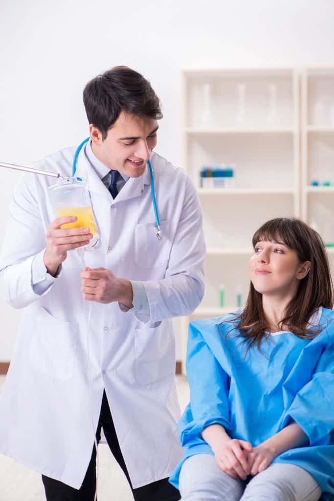 plasma center doctor speaking with the donor