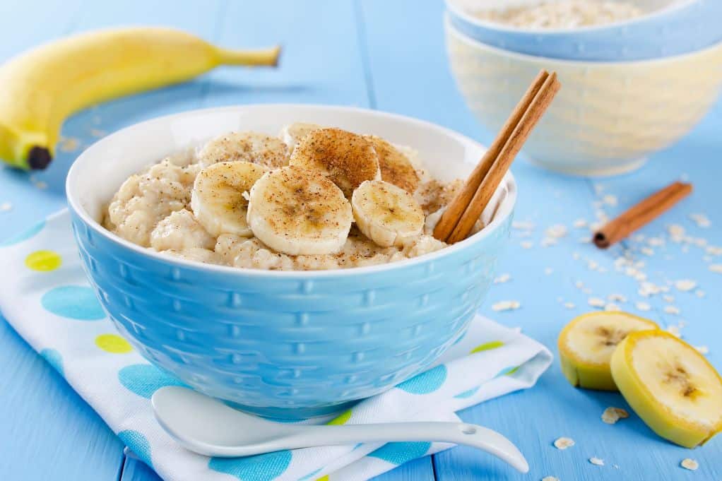 bowl of oatmeal topped with banana