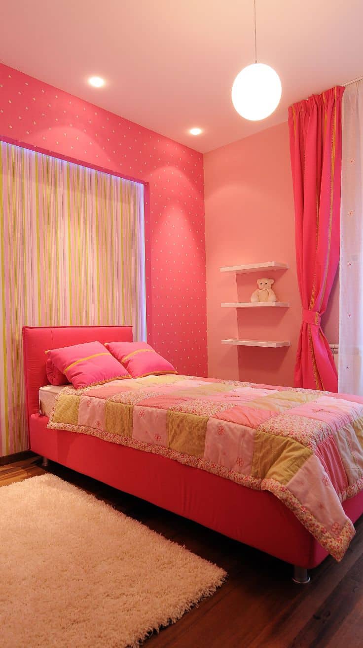 bright pink bedroom with pink bedding and walls